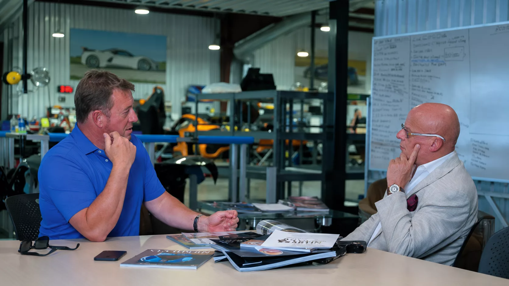 John Hennessey standing beside a Hennessey Venom F5 hypercar